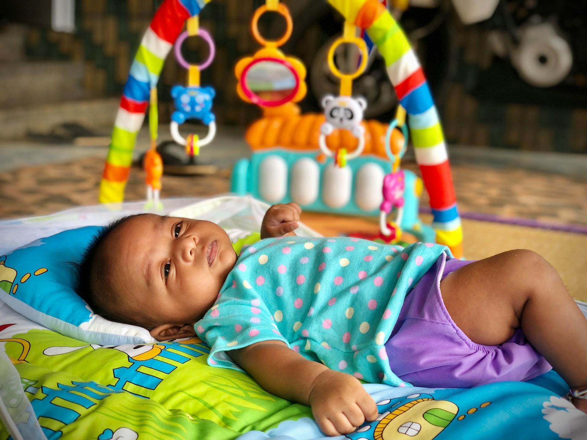 Parent and two-week-old baby making eye contact